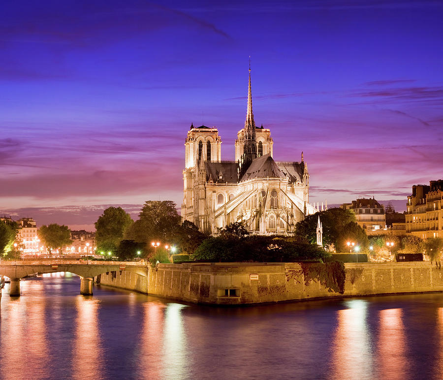 Dusk At Notre Dame Cathedral In Paris Photograph by Deejpilot