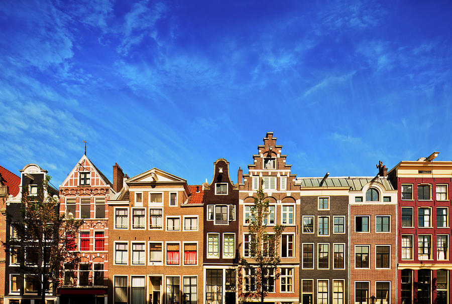 Dutch Canal Houses In Amsterdam Photograph by Nikada