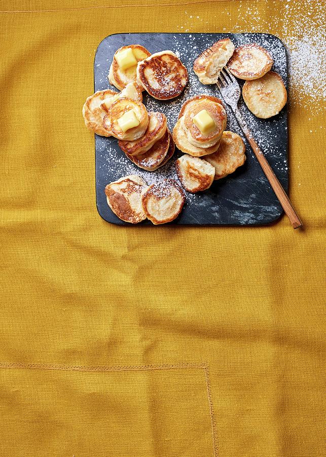 Dutch Poffertjes With Butter And Icing Sugar Photograph by Great Stock!