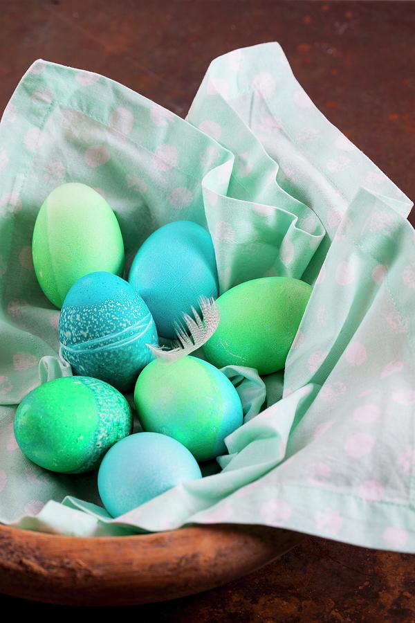 Dyed Easter Eggs With Batik Patterns On A Cloth In A Basket Photograph by Elisabeth Von Plnitz-eisfeld