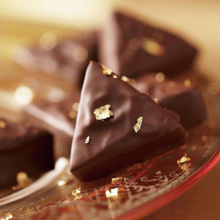 Earl Grey Pralines With Gold Leaf Photograph by Oliver Brachat