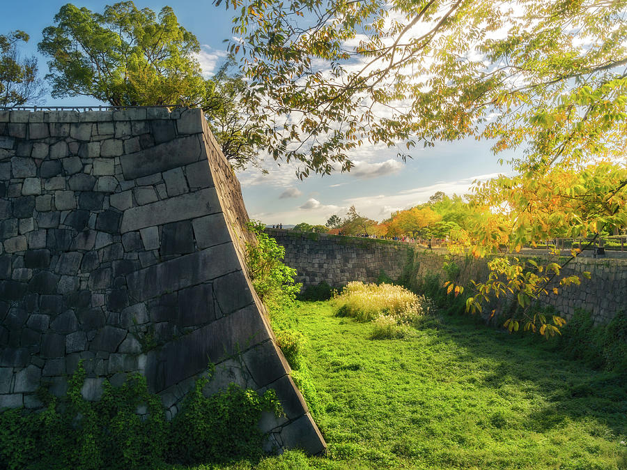 Early morning sun at the moat and fortifications of Osaka Castle by Daniela Constantinescu Early morning sun at the moat and fortifications of Osaka Castle by Daniela Constantinescu