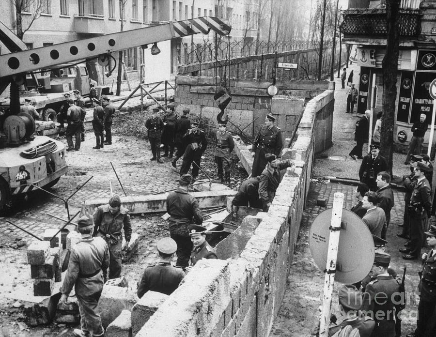 East Berlin Policemen Repairing Wall Photograph by Bettmann