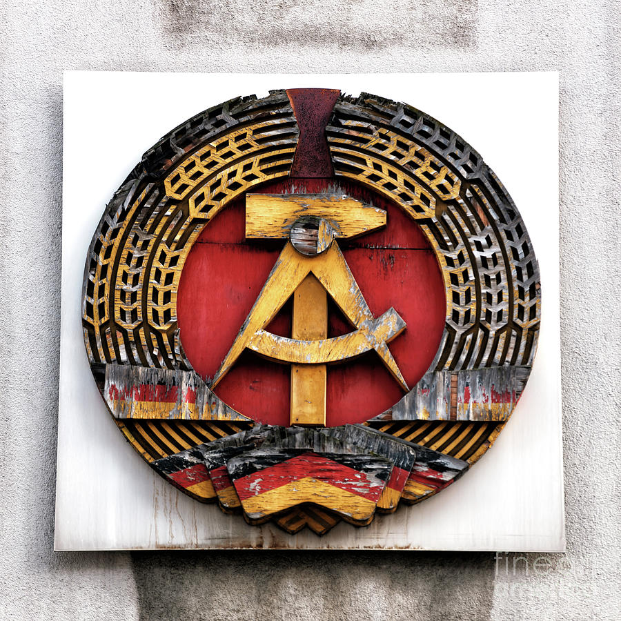 East Germanys National Emblem at Checkpoint Charlie Berlin Photograph by John Rizzuto