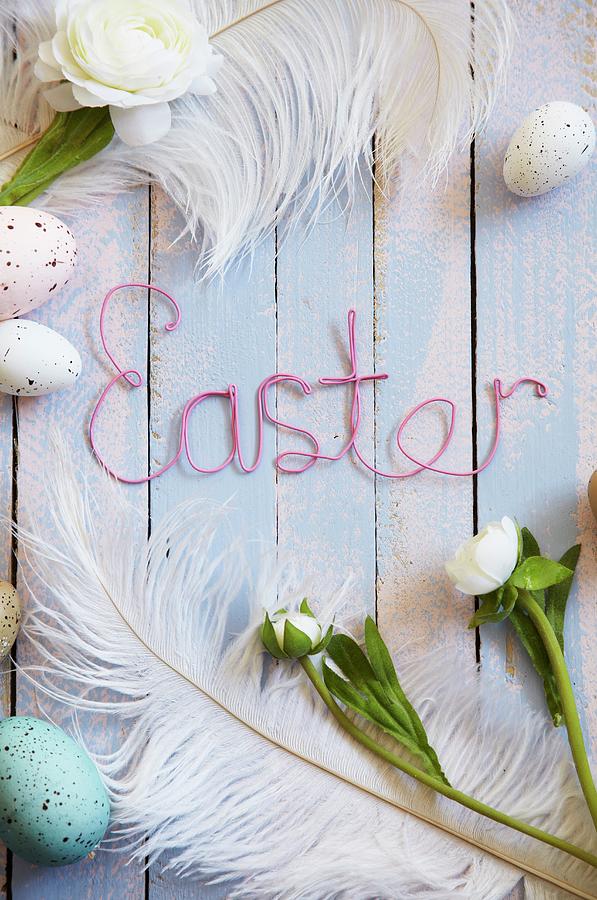 Easter Arrangement Of Eggs, Feathers, Flowers & easter Written In Wire Photograph by Simon Scarboro