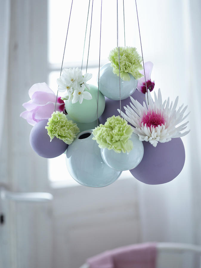 Easter Arrangement Of Flowers In Suspended Spherical Vases Photograph by Julia Hoersch
