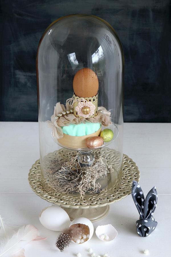 Easter Arrangement Under Glass Cover, Egg Shells, Feathers And Napkin Bunny Photograph by Regina Hippel