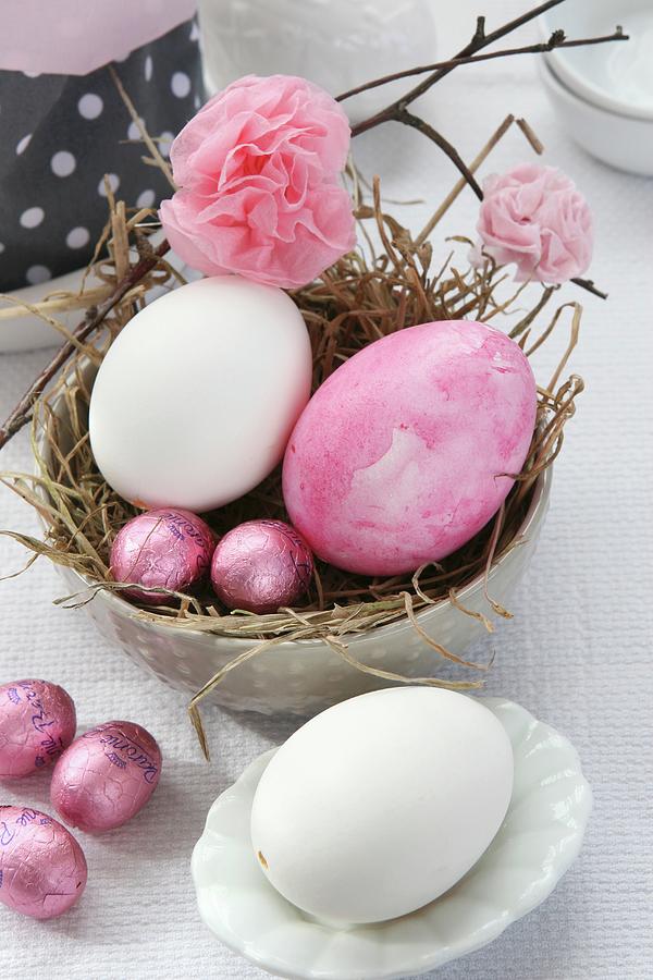 Easter Arrangement With Straw Nest In Dish, Easter Eggs, Chocolate Eggs And Paper Flowers Photograph by Regina Hippel