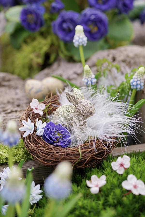 Easter Basket With Flowers, Feathers And Easter Bunny Photograph by Angelica Linnhoff