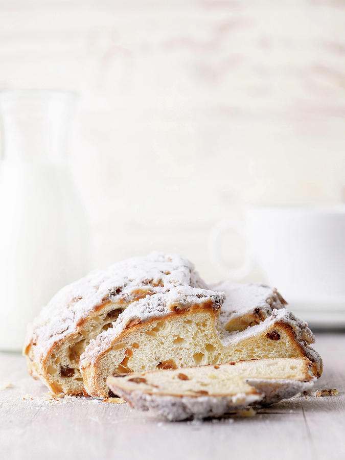 Easter Bread With Raisins And Powdered Sugar, A Piece Cut Photograph by Sylvia Meyborg