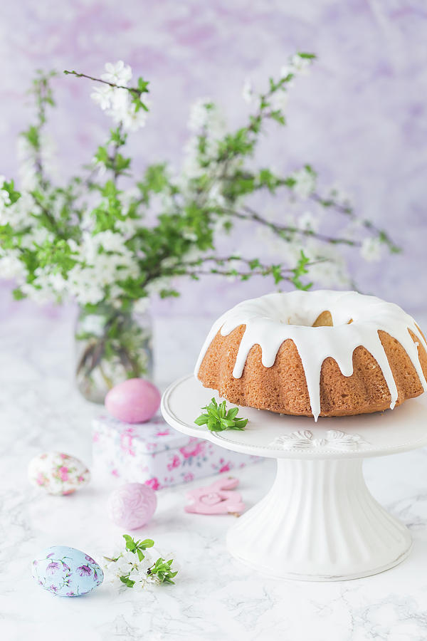 Easter Bundt Cake With Royal Icing, On A Cake Stand Photograph by Malgorzata Laniak