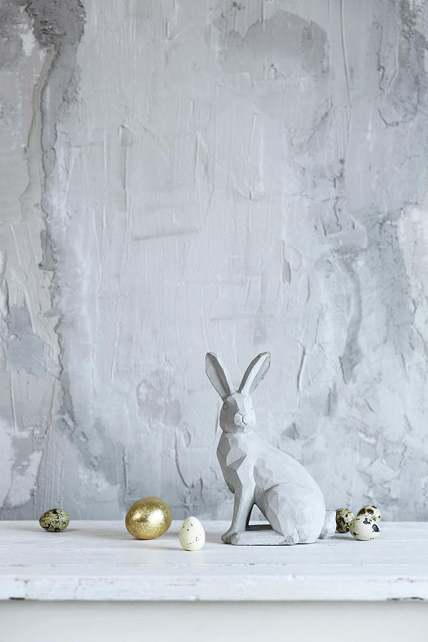 Easter Bunny And Eggs Against Grey Rendered Wall Photograph by Thordis Rggeberg