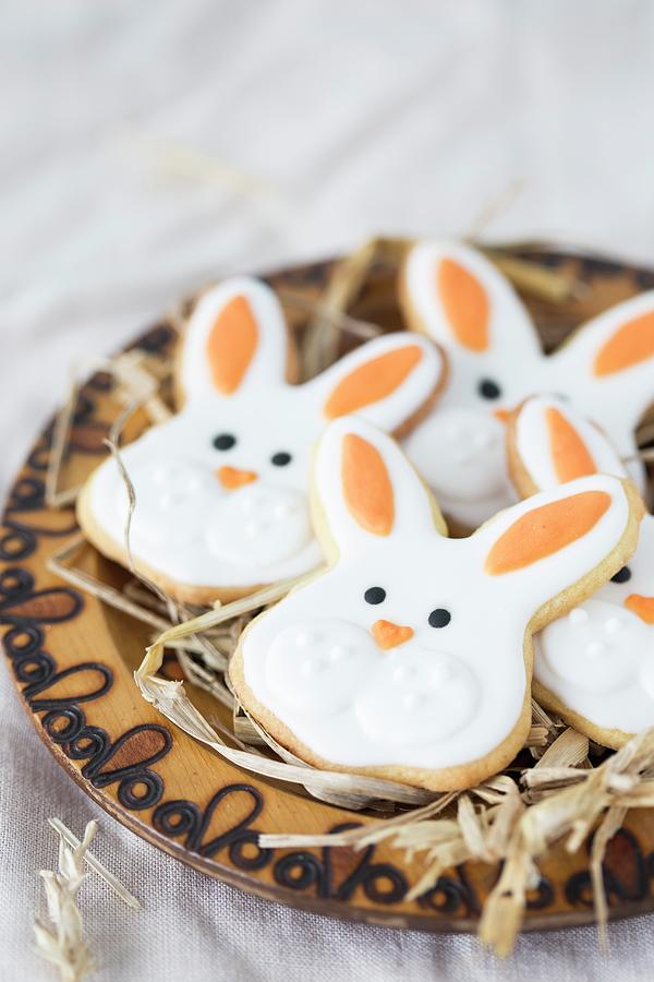 Easter Bunny Cookies On A Wooden Plate With Straw Photograph by Malgorzata Laniak