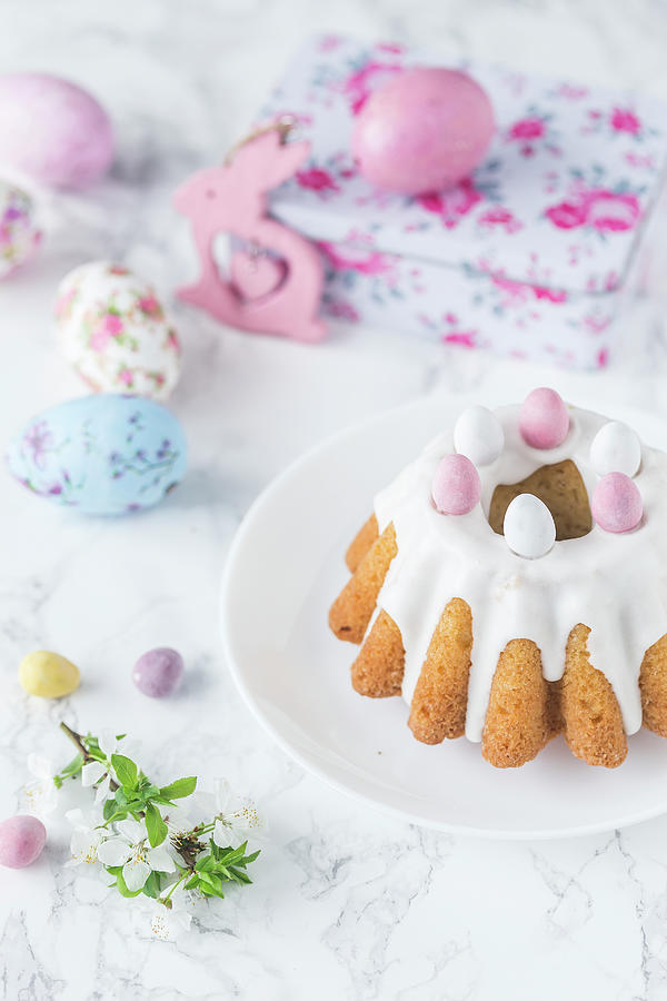 Easter Cake With Icing And Candy Sugared Eggs Photograph by Malgorzata Laniak
