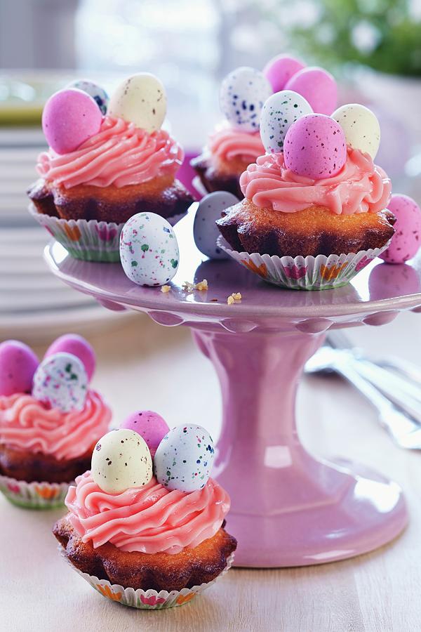 Easter Cakes With Topped With Pink Buttercream And Sugar Eggs On Cake Stand Photograph by Franziska Taube