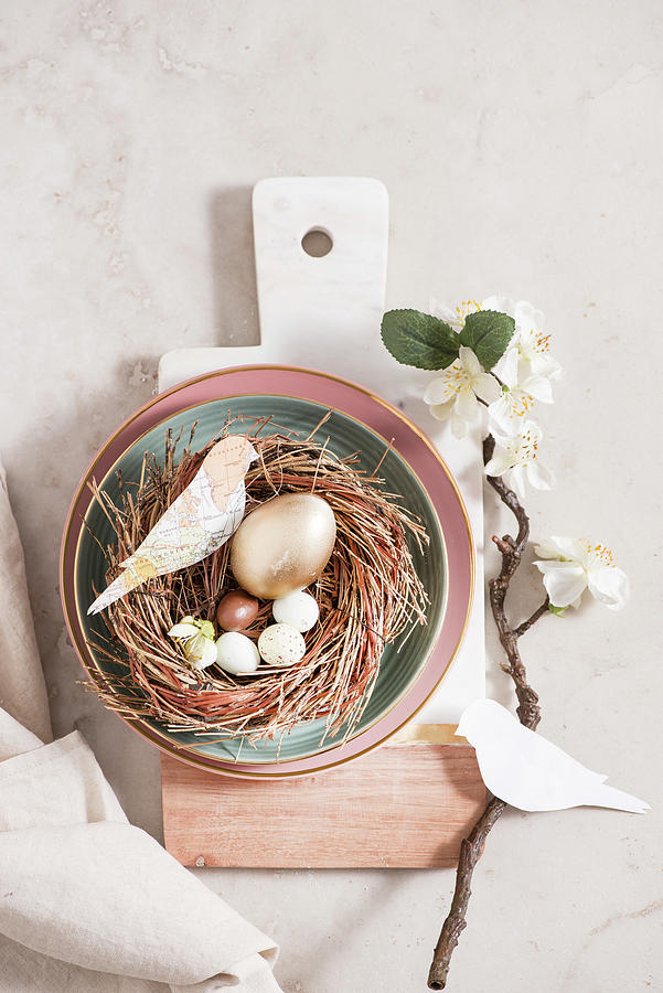 Easter Decoration: An Easter Nest Decorated With A Spring Of Blossom And Homemade Paper Birds Photograph by Fotografie-lucie-eisenmann