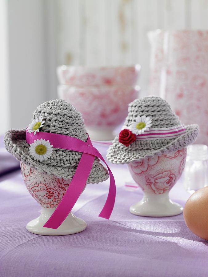 Easter Decorations: Egg Cups Decorated With Crocheted Hats Photograph by Jalag / Olaf Szczepaniak