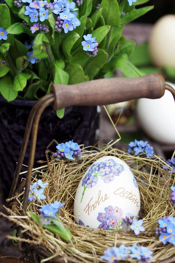 Easter Egg Decorated With Forget-me-nots In Small Basket Photograph by Angelica Linnhoff