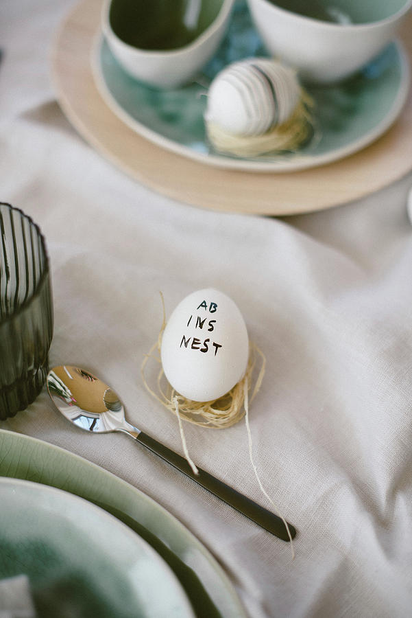 Easter Egg Decorated With Lettering On Set Table Photograph by Katja Heil