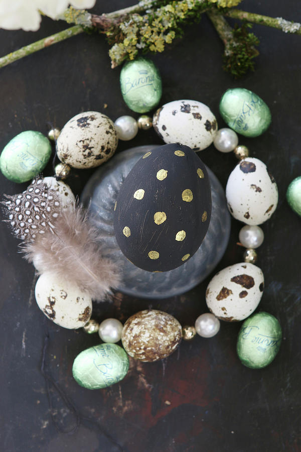 Easter Egg Painted Black And Gold In Circlet Of Quail Eggs Photograph by Regina Hippel