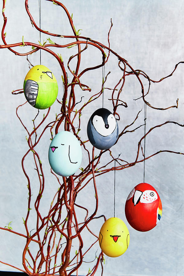 Easter Eggs Decorated With Bird Motifs Hung From Twigs Photograph by Brigitte Sporrer