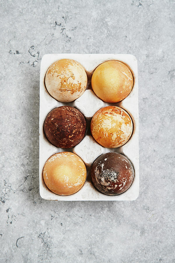 Easter Eggs Dyed With Turmeric And Black Tea Photograph by Brigitte Sporrer