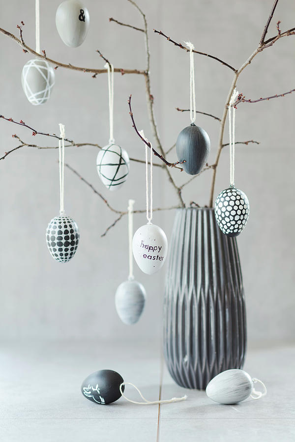 Easter Eggs Hand-painted In Shades Of Grey Hanging From Twigs Photograph by Jan Wischnewski