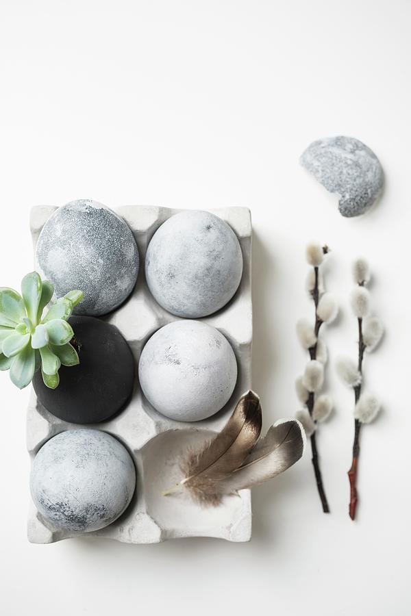 Easter Eggs Painted With Stone Effects In Concrete Egg Box Photograph by Pia Simon
