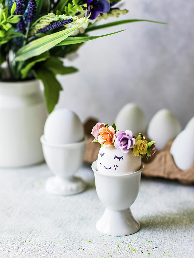 Easter Eggs With Flower Decorations In Eggcups Photograph by Maria Squires