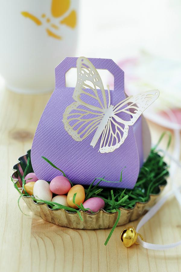 Easter Gift In Gift Box With Paper Butterfly In Easter Nest In Tart Tin Photograph by Franziska Taube