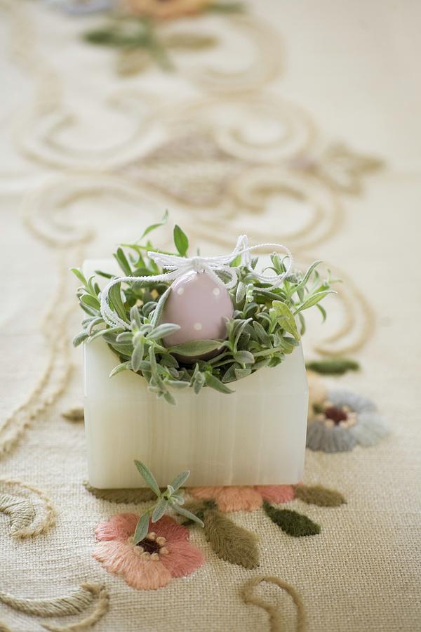 Easter Nest Made From China Egg And Green Plant In Alabaster Pot On Embroidered Vintage Tablecloth Photograph by Alicja Koll