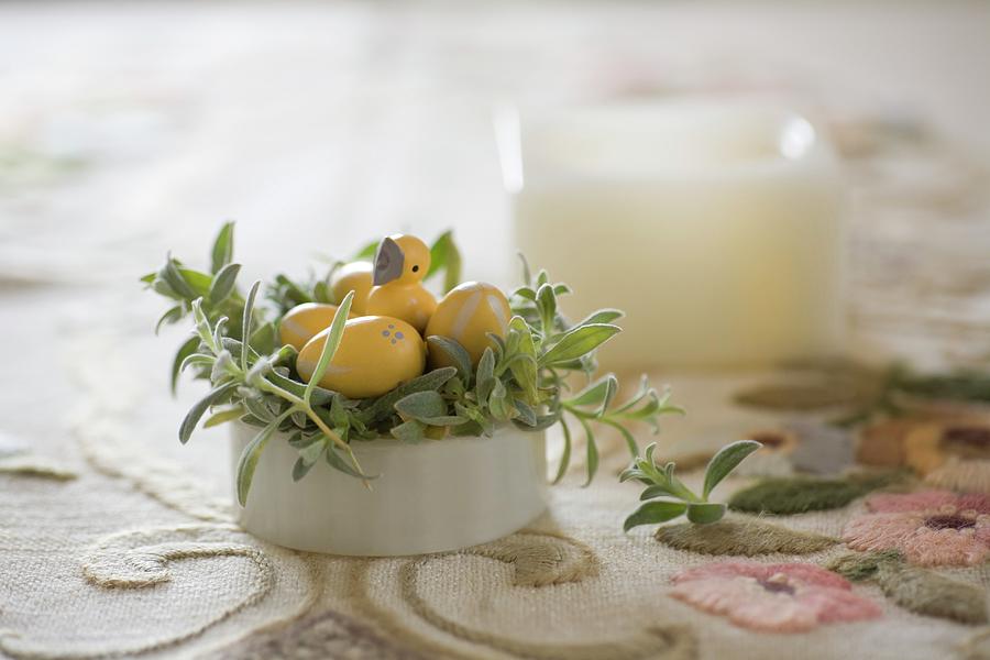 Easter Nest Made From Planted China Pot With Yellow Wooden Eggs And Chick Ornament Photograph by Alicja Koll