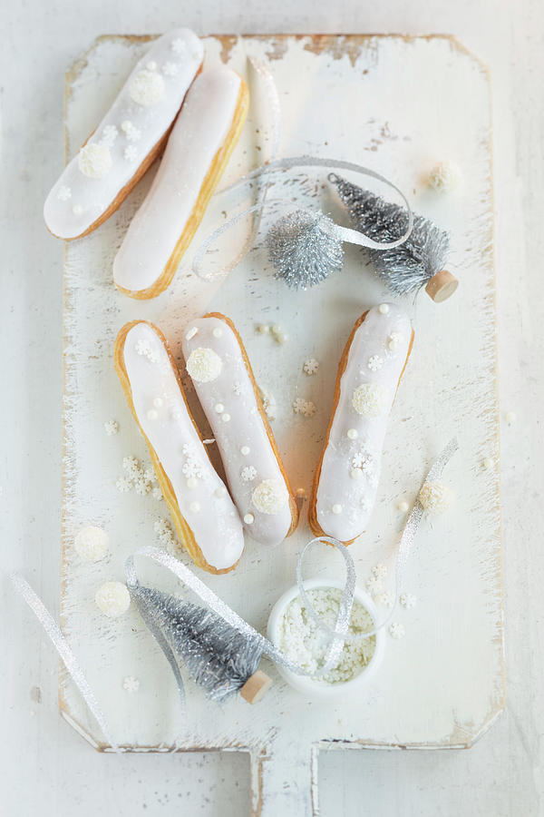 Eclairs Decorated With White Glaze And Sugar Stars For Christmas Photograph by Eising Studio