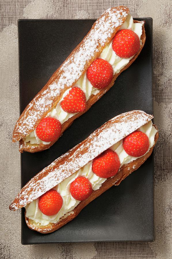 Eclairs With Cream And Strawberries Photograph by Jean-christophe Riou