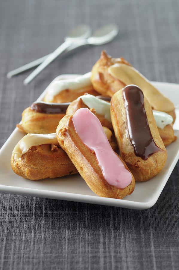 Eclairs With Various Different Toppings Photograph by Jean-christophe Riou
