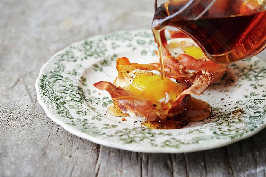 Egg In Crispy Parma Ham With Maple Syrup Photograph by Greg Rannells