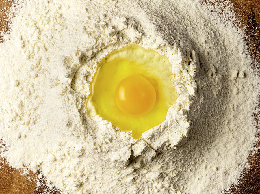 Egg In Flour Photograph by Jeffrey Coolidge