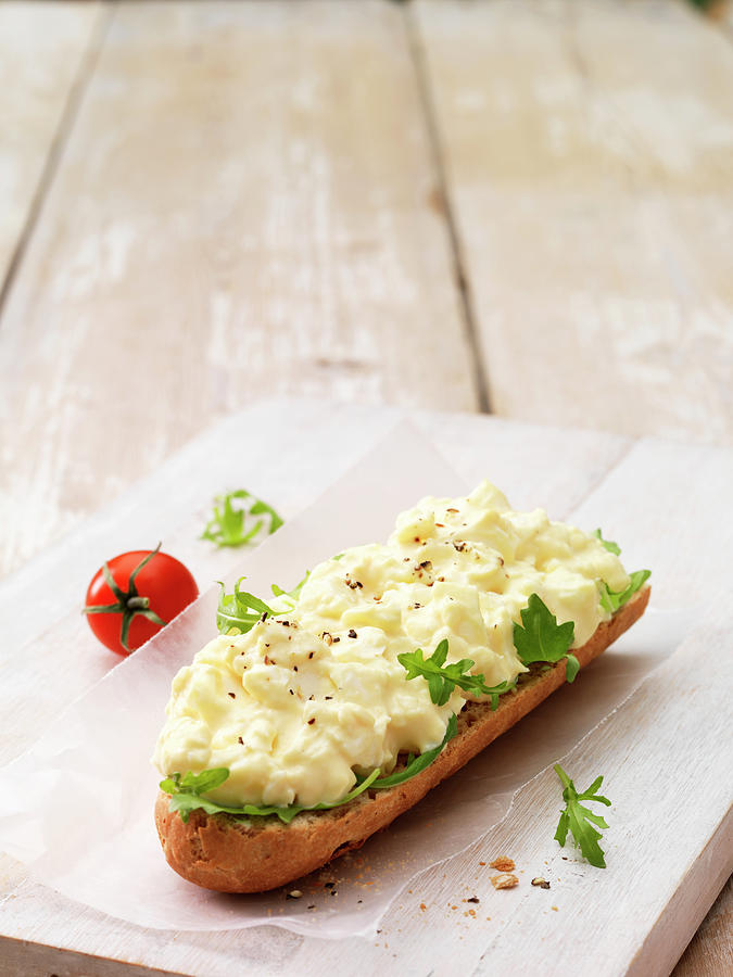 Egg Mayonnaise With Ground Pepper On Crusty Baguette With Salad Leaves