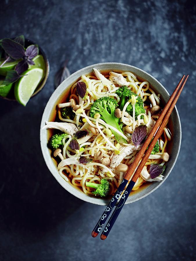 Egg Noodle Soup With Chicken, Broccoli, Beansprouts, Enoki Mushrooms, Thai Basil And Limes asia Photograph by Thorsten Kleine Holthaus