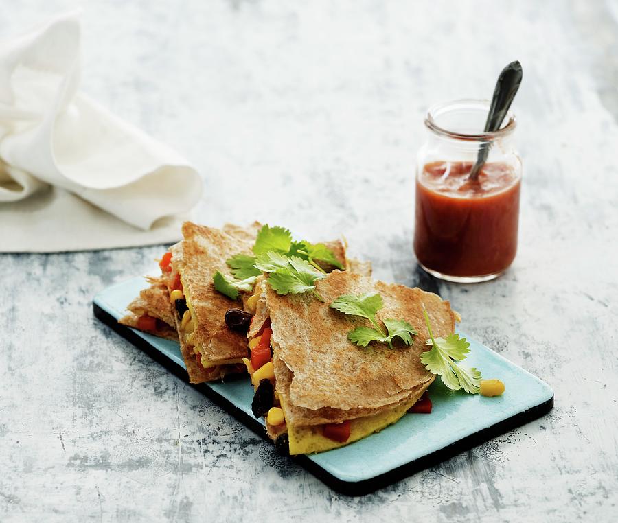 Egg Quesadillas With Corn, Coriander And Tomato Sauce Photograph by Mikkel Adsbl