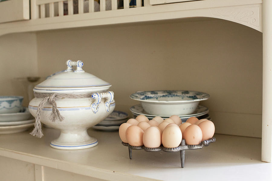 Egg Rack, Soup Tureen And Old Crockery On Kitchen Dresser Photograph by Camilla Isaksson