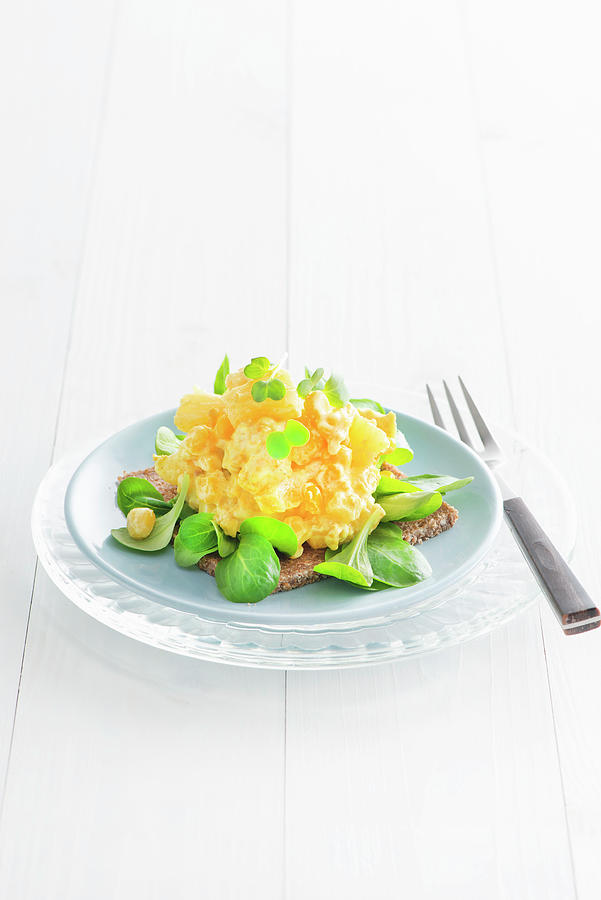 Egg Salad With Lambs Lettuce On A Slice Of Pumpernickel Bread Photograph by Fotografie-lucie-eisenmann