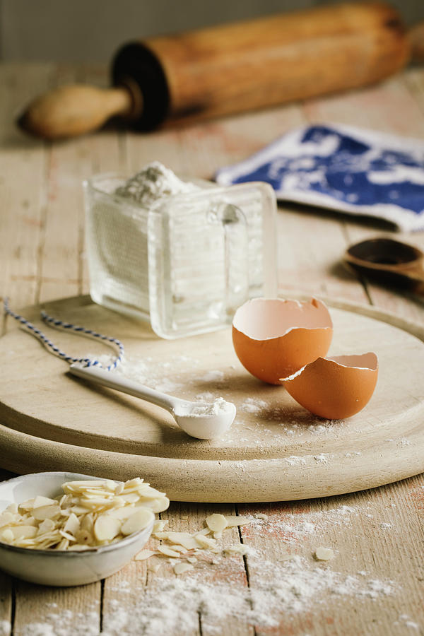 Egg Shells, Flour, Slivered Almonds And A Rolling Pin Photograph by Jennifer Braun