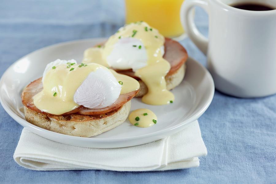 Eggs Benedict an English Muffin With Ham, Poached Egg And Hollandaise Sauce, Usa Photograph by Eising Studio - Food Photo & Video