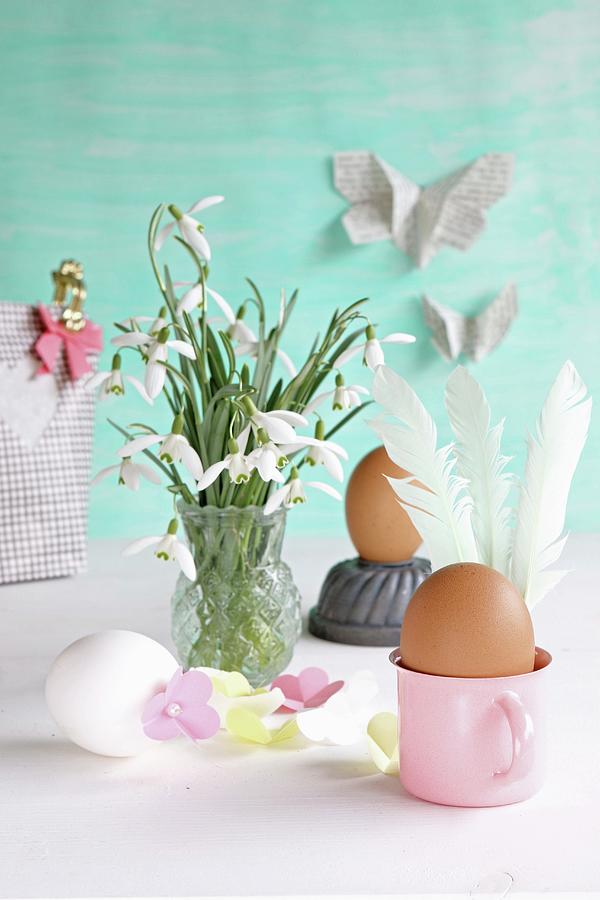 Eggs Decorated For Easter With Feathers And Paper Flowers Next To Vase Of Snowdrops Photograph by Regina Hippel