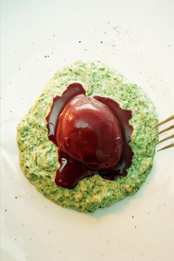 Eggs In Red Wine On Green Sauce Photograph by Michael Wissing
