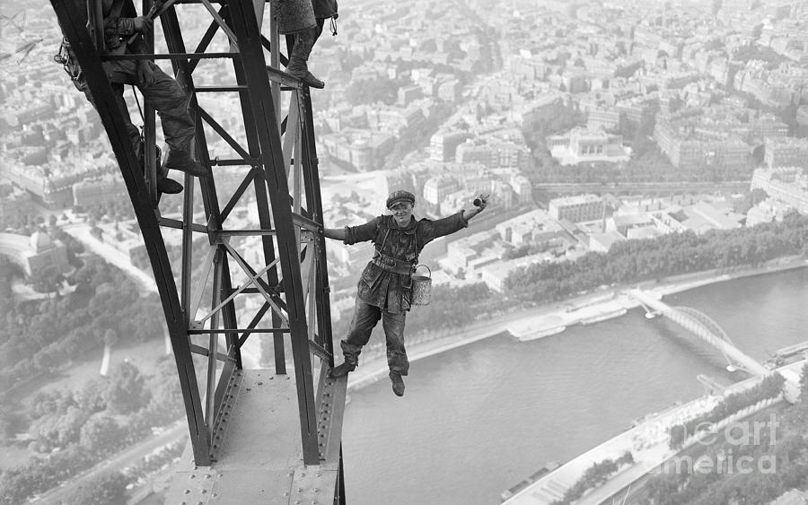 Eiffel Tower Painter Makes Risky Pose Photograph by Bettmann