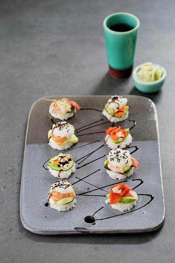 Eight Mini Sushi Burgers On A Ceramic Plate With Smoked And Fresh Salmon, Surimi And Shrimp Photograph by Tina Engel