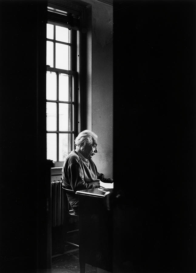 Black And White Photograph - Einstein Sitting Alone by Alfred Eisenstaedt