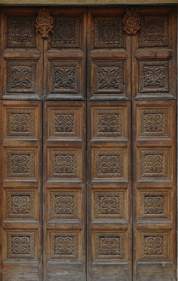 Elaborate carved wooden doors of Cathedral of St Catherine Photograph by Steve Estvanik